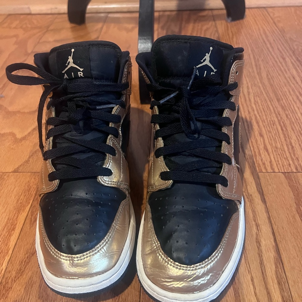 Air Jordan 1 Mid Black and Metallic Gold Sneakers